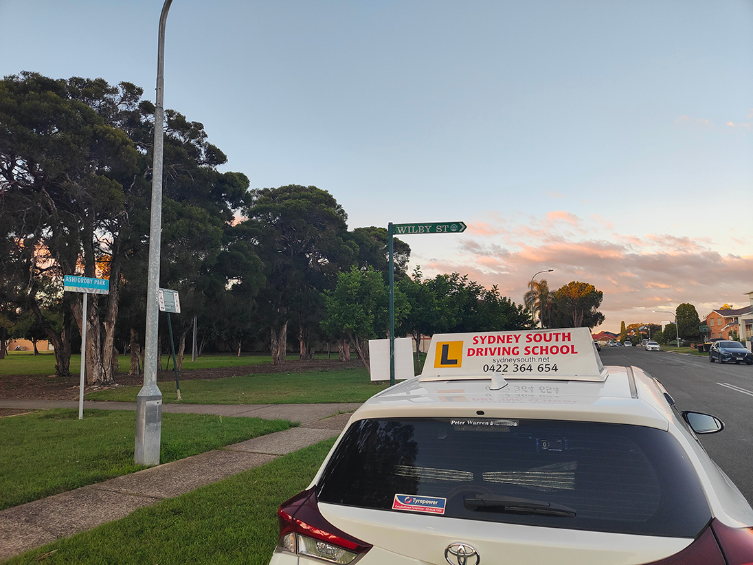 Learner driver practising early car control on a quiet residential street in Cabramatta