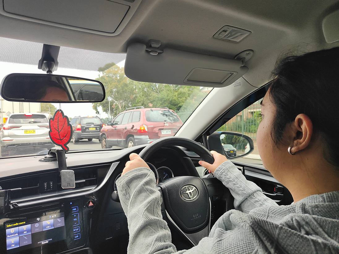 Learner driver practising safe driving in real traffic with Sydney South Driving School